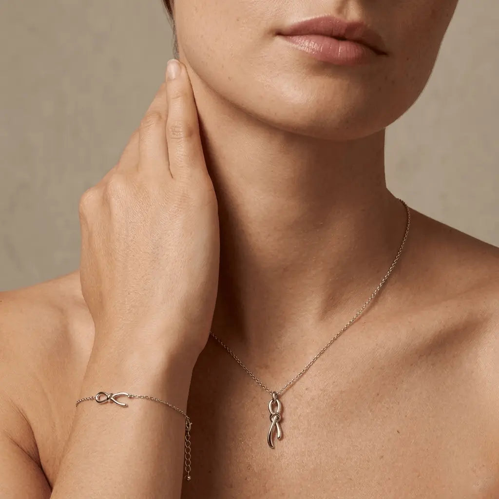 Nodessa – 925 Silber Schmuckset vergoldet mit Knoten Anhänger - Suzan Gold