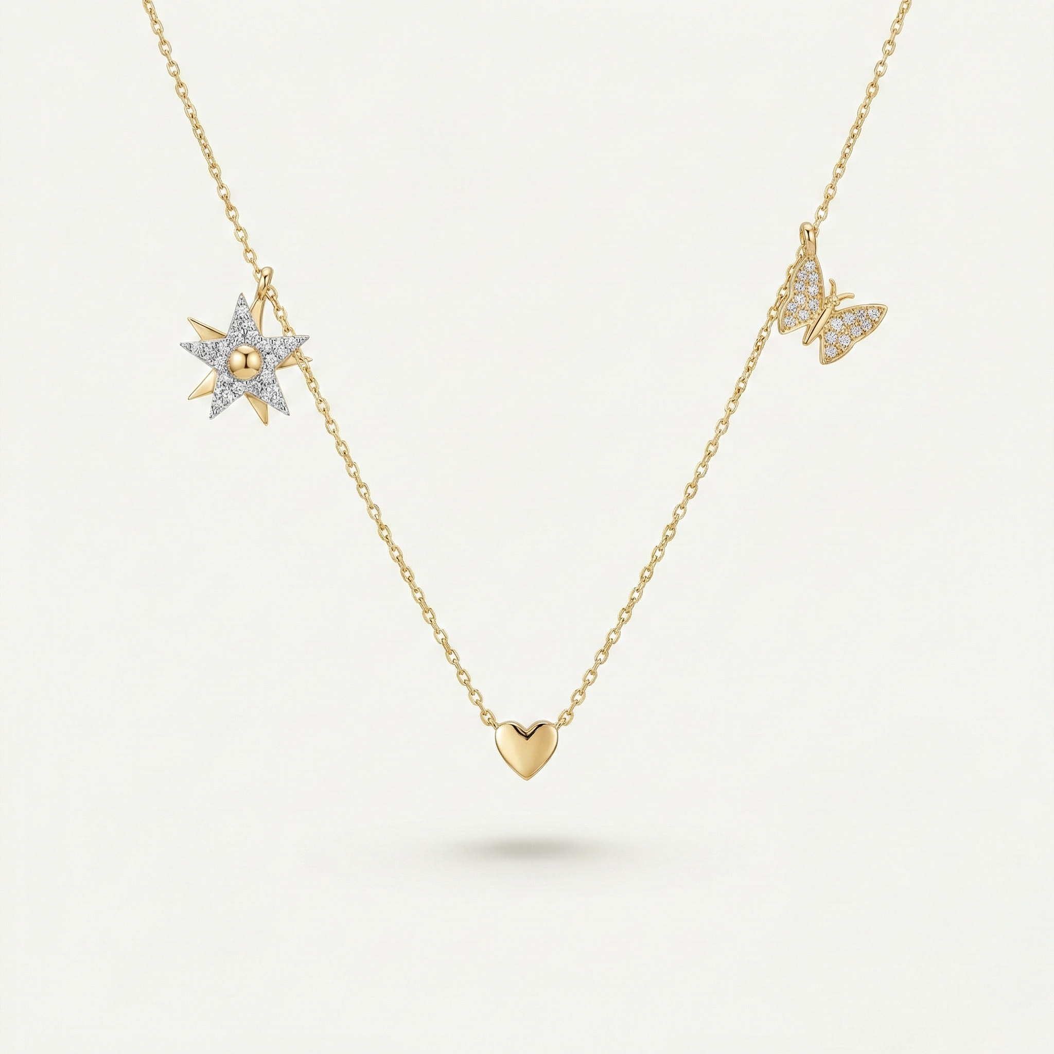 Celestique Trio – 375 Echtgold Halskette mit Herz Stern und Schmetterling Anhängern